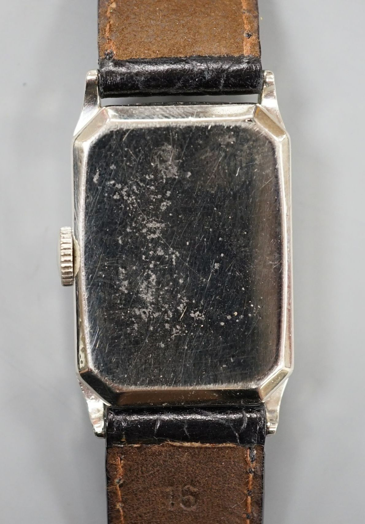A gentleman's 14k gold filled Gruen manual wind wrist watch, on a leather strap.